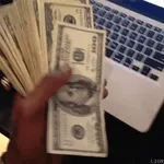 Cash Money Records CEO Birdman shows off his money.